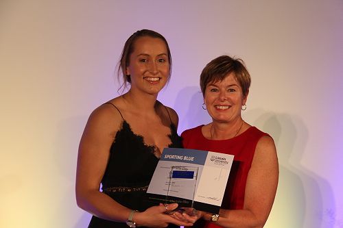Charlotte Elley receiving her Lincoln University Blue for Netball from Chief Operating Officer Philippa Jones