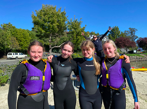 Mia Revell-Lynch, Kate McGowan, Alix Dohig and Keira Hollamby all smiles ahead of undertaking the kayaking challenge