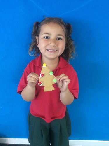 Marnie is excited about eating her gingerbread tree.