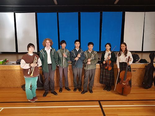 Orchestra Students helping at Westburn School