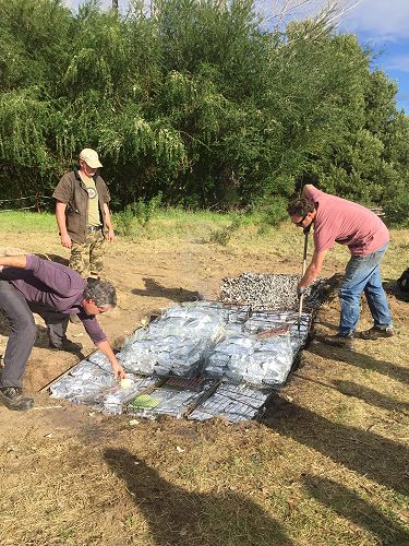 We had to make sure the food was laid evenly over the hangi irons and stones. 