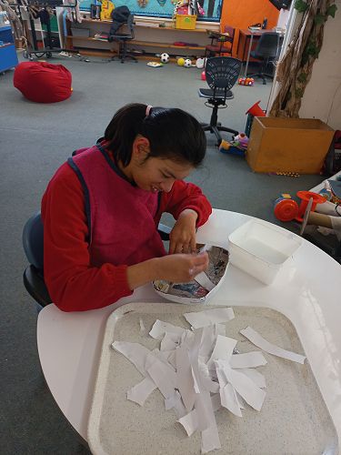 Daisy loves to rip paper for our Paper Mache projects. She doesn't even mind sticky fingers.