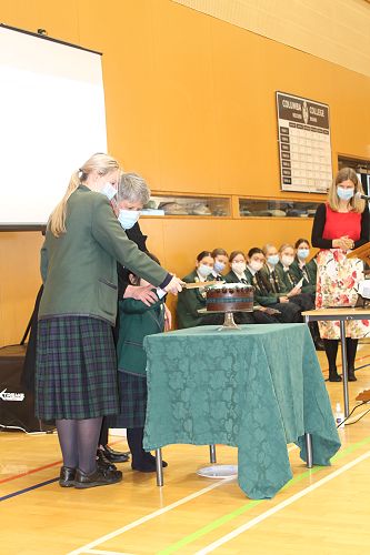 Mrs Duthie, Rosa Lines and Vivienne Khan cut the cake