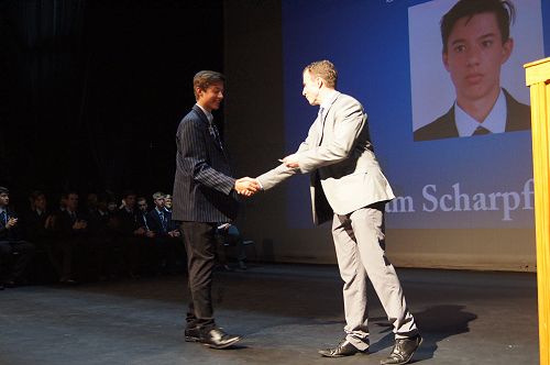 Mr Brewster congratulates William Scharpf on his performance.