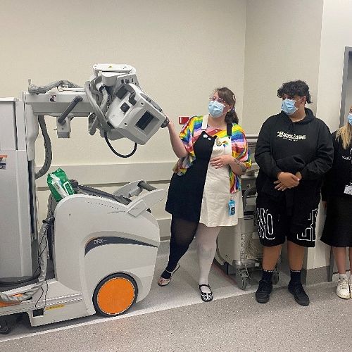 Pyper is shown how the portable X-Ray Machines work by Radiographer Katie.