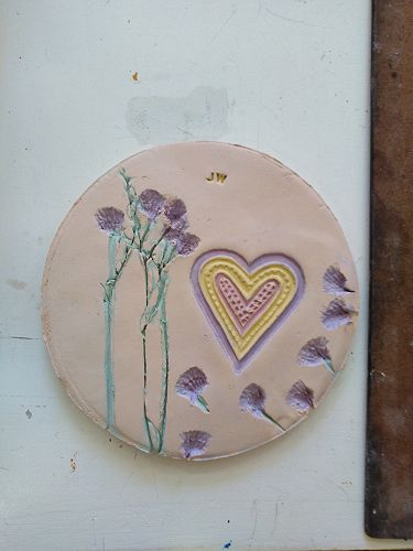 Justin room 19 Plaque made using Trade Aid Heart and flowers from the Heaton flower tributes.