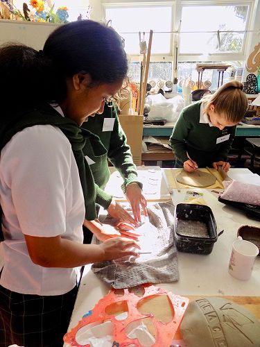Making seeded hearts from Papier Mache.