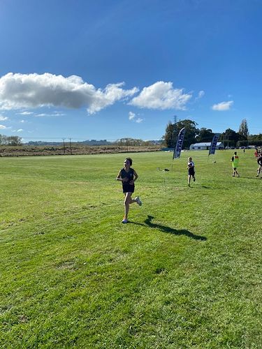 Ruby Nicholson finishing the 3km run for Columba Yellow