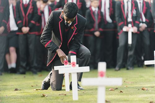 In memory: Stefan Marasinghe Arachchige Don places a cross on the College Quad.