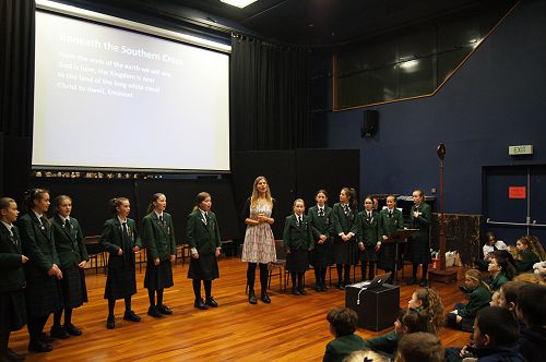 Singing 'Beneath the Southern Cross' with helpers from the Junior Choir