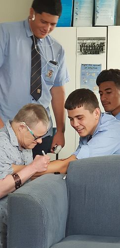 Neil giving a tattoo to Tahoura
