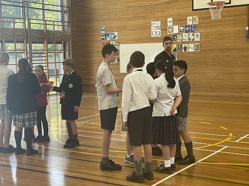 Oscar R12 collaborating with other ChCh Year 7 students in team leadership challenges