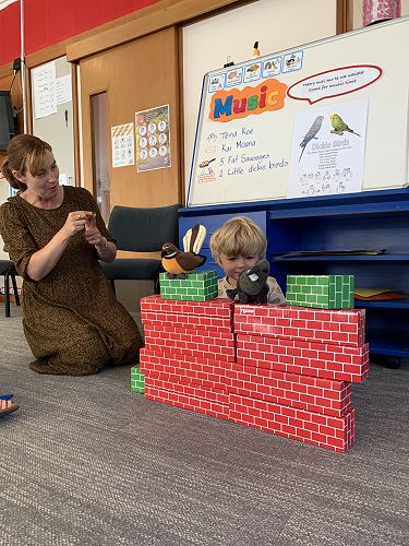 Tina and Billy acting out Two little dickie birds