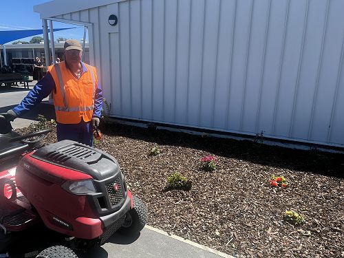 Mr Walker, our caretaker, liking the look of the new garden.
