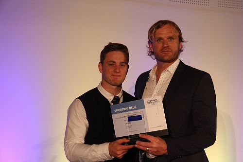 Brett Cameron receiving his Lincoln University Blue for Rugby from Scott Roberston