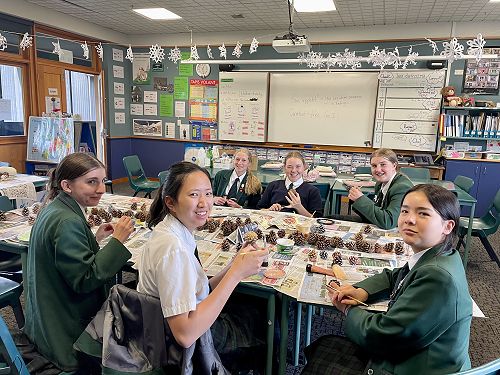 Some year 10 students painting pinecones
