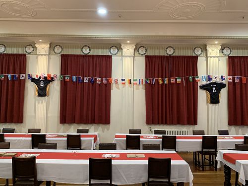 International flags and St Margaret's College football jerseys decorate the Dining Hall