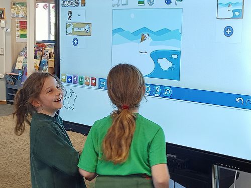 Emelia R and Grace using scratch on the Commbox