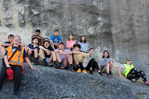 Level 2 General Science class pausing under the limestone cliffs at Kakahu.