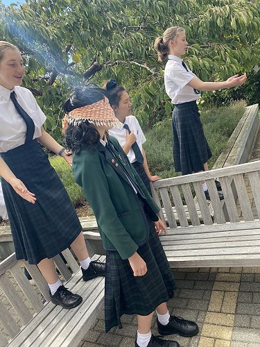 Poppy Edmond leads around an old lady (Kate McGowan) using respectful language. 