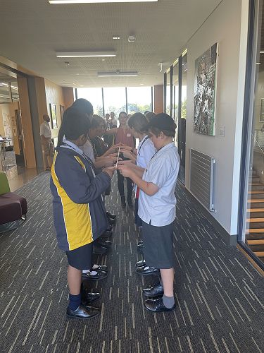 Asher & Alex R7 problem-solving in a stick team challenge