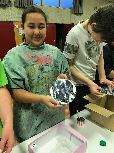 Lelia with her art work.  