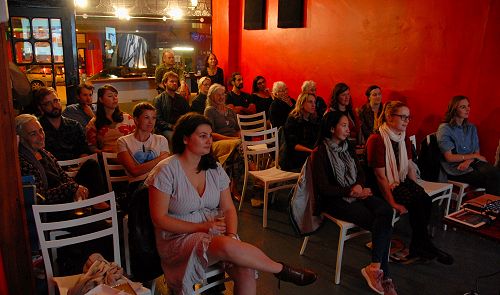 A Bark! crowd watching a Pecha Kucha event. Image