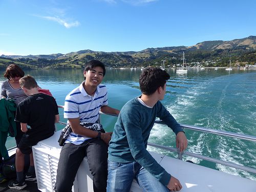 Keigo and Louis heading out on a black Cat Nature Cruise in Akaroa.