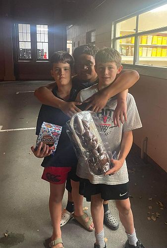 Sugar rush: From left, Ryan Gardiner, Lui Vaipulu and Elliot Markillie after the Easter egg hunt.
