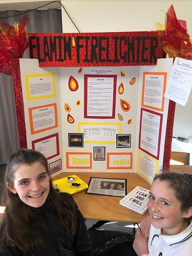 Aria Winter and Olivia Shore showcasing their research