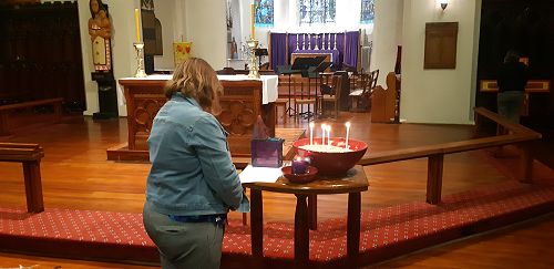 Lorraine Benford praying for the ministry of the church