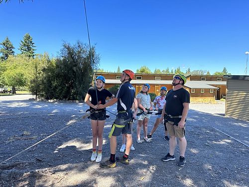 Noel, Emma, Danielle and Beatrice watching on at the tree climbing activity