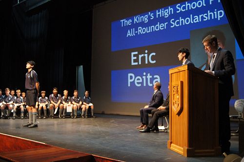 Eric Peita listens as his citation is read out. His brother and Head Boy, Chanse, presented him with the award.