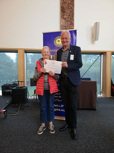 Mary Corbett receiving her 20 year MOJ Long Service certificate