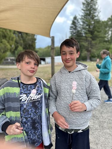 Tom and Brody with their yet-to-be toasted marshmallows