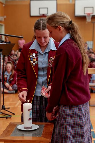 Sisters, Morgan (year 13) & Bethany (year 9) Oudemans light the College candle to begin the new year