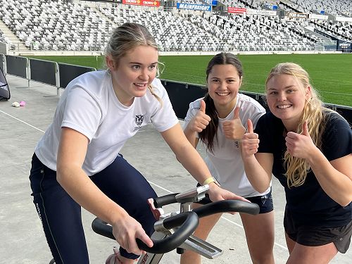Brenna blitzing it on the bike with Neve and Hannah in support