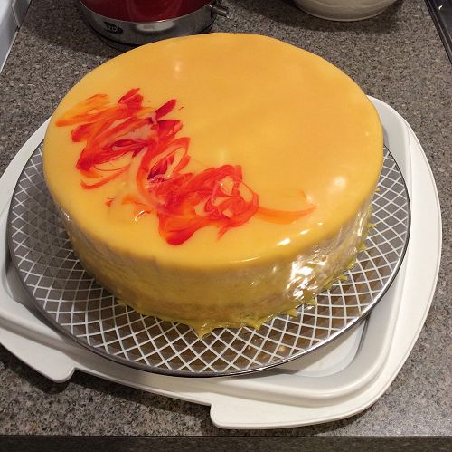 White chocolate and apricot mousse cake with mirror glazing