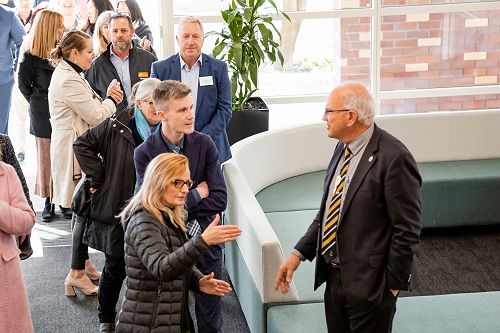 Grant Lander chats with teachers Jonathan Cameron and Lile Price