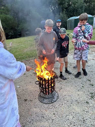 Archie, Riwai and Jake getting into the marshmallow toasting