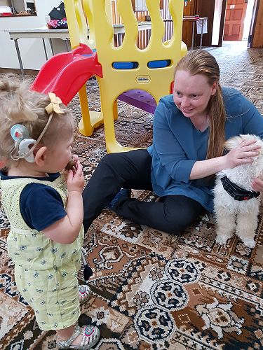 Beca Harper shows Charlotte Oliver her dog Winston