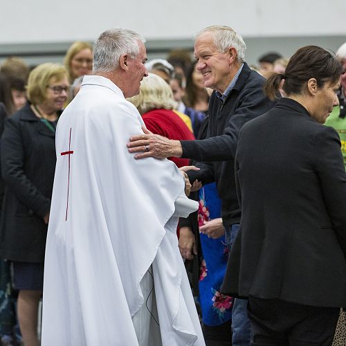 Welcome: Father Mark Walls SM greets members of the community at the Feast Day Mass.