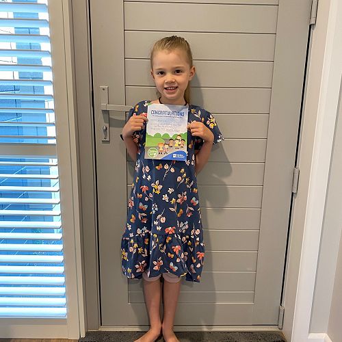 Bianca with her 100 walks certificate