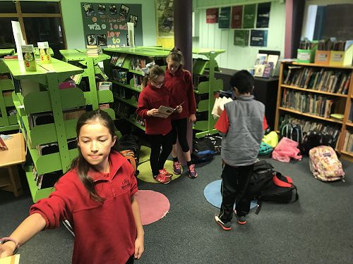 What do you do during downtime in a Literature Quiz Competition? Read a book of course!