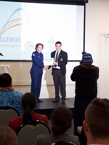 Tiaki Rhodes receiving his Altrusa Award