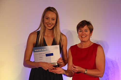 Bella James receiving her Lincoln University Blue for Netball from Chief Operating Officer Philippa Jones