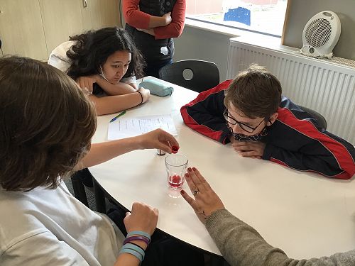 Working
as a group to complete a Science experiment in the Provision, Layering Liquids,
to learn about density.