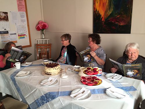 Left—right: Kathy, Maureen, Kris and Shirley having a read of the latest issue (April 2019) before morning tea after packing all the magazines.