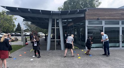 Sina and Katelyn trying to complete an obstacle course and text at the same time. They were slow at completing the course failed to complete the text, proving that you cannot focus on your phone while driving.