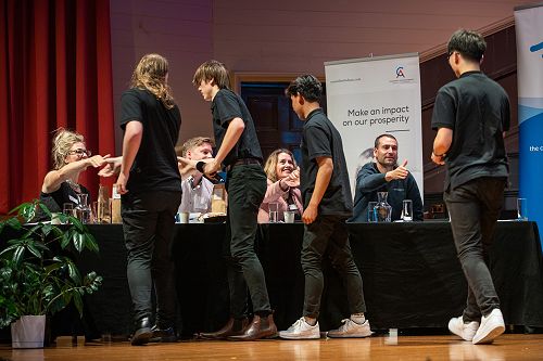 Rizer shake hands with the judges